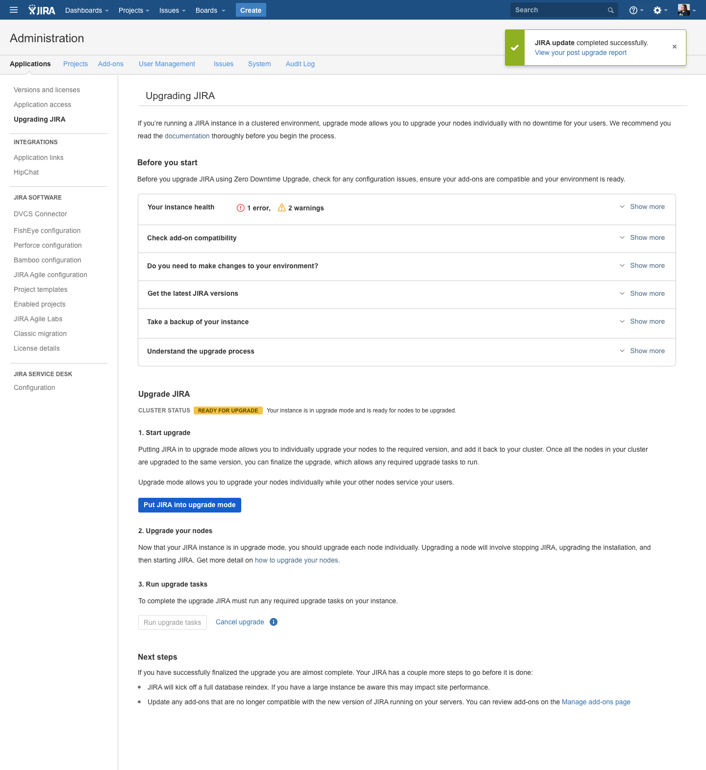 Jira Data Center 'Upgrading JIRA' administration page after a successful upgrade: a green success banner reading 'JIRA update completed successfully. View your post upgrade report', the 'Put JIRA into upgrade mode' button restored to an active state, and the 'Run upgrade tasks' button disabled, signalling the environment has returned to normal operation.